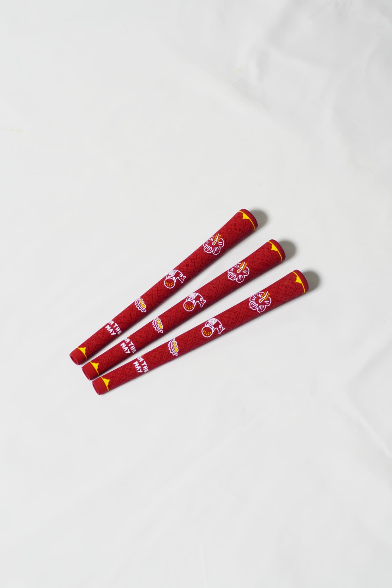 Three red MY.FLAVOURS golf grips